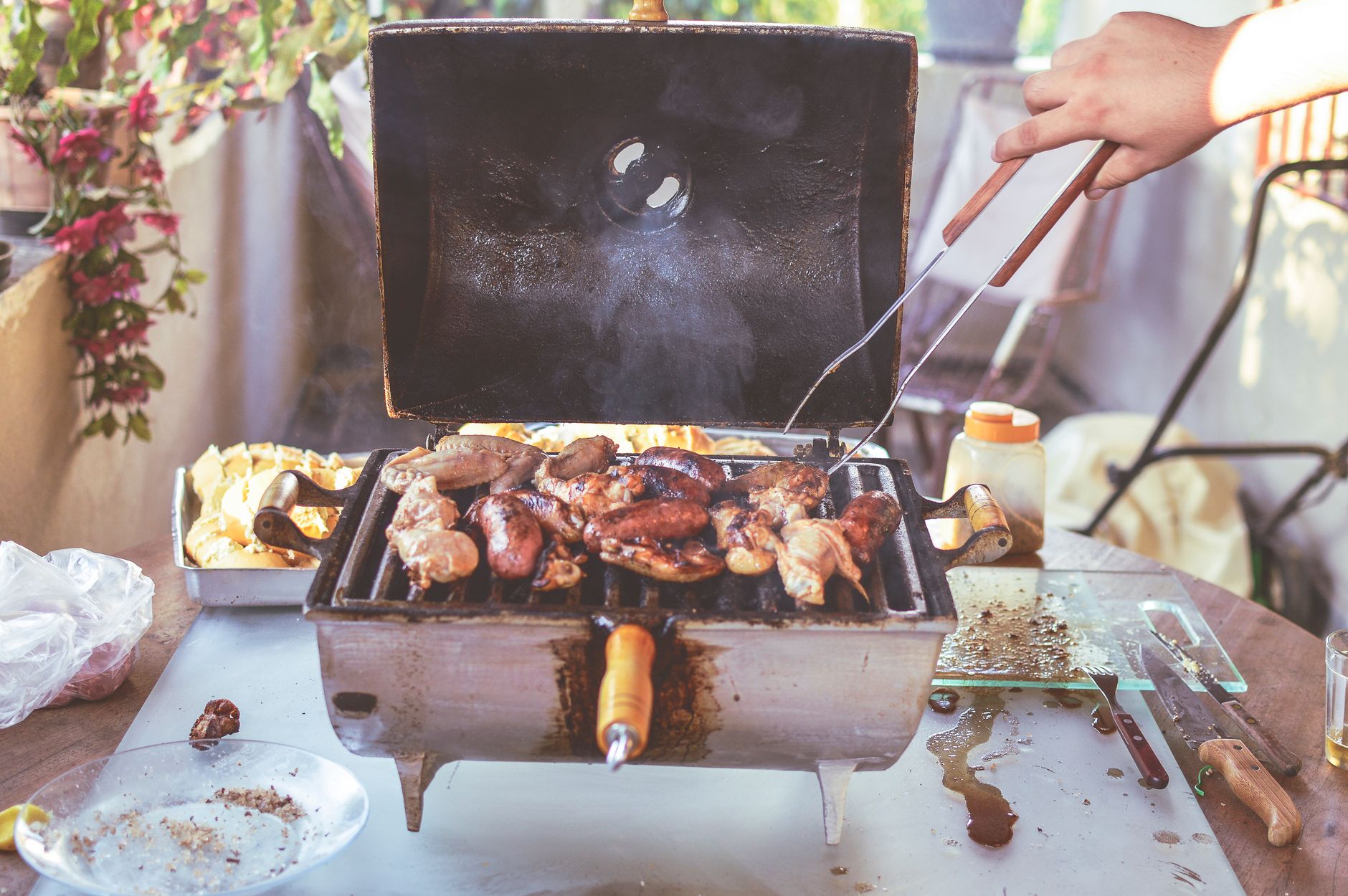 Built-in outdoor grill positioned near a fence, illustrating a layout mistake