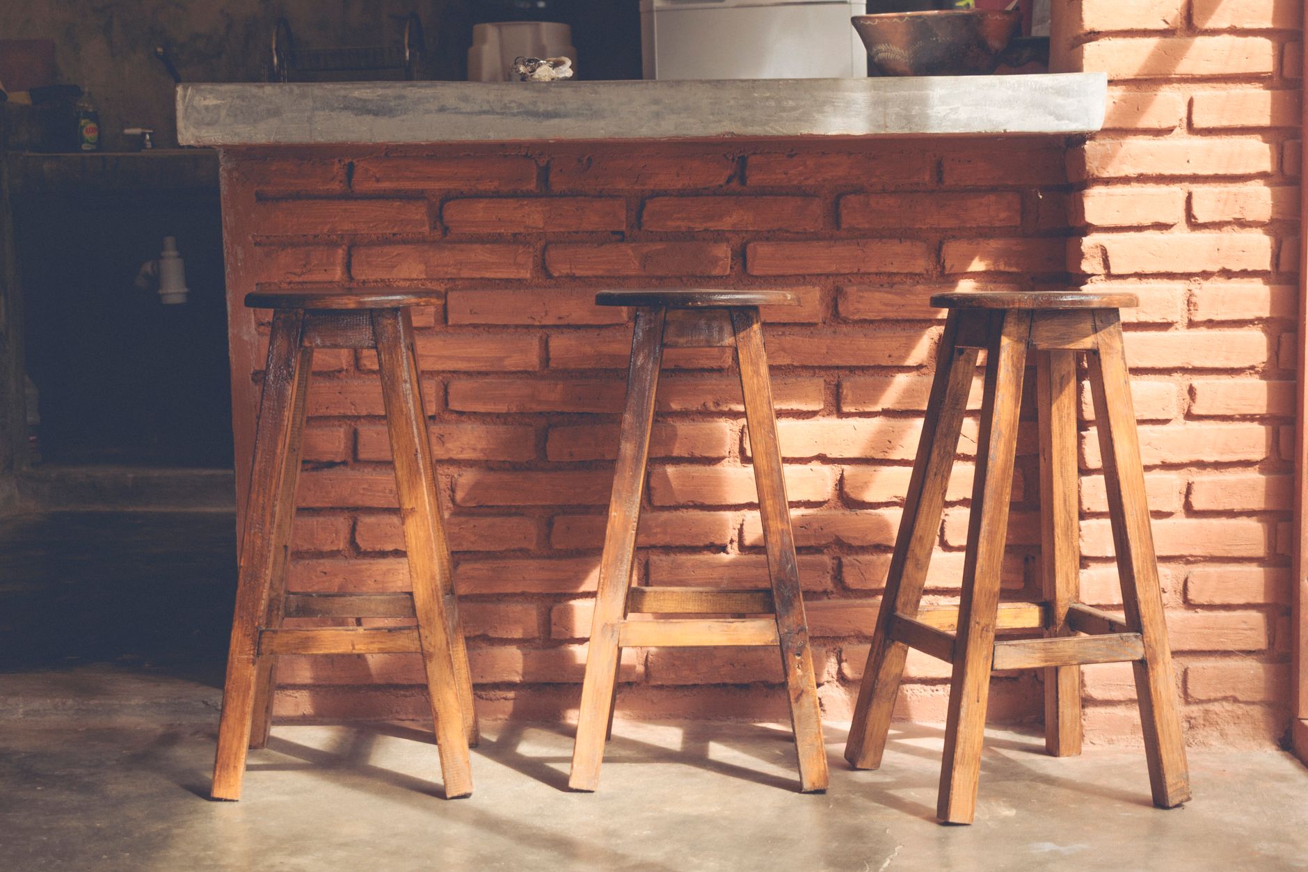 Outdoor kitchen with bar seating on a large West County lot